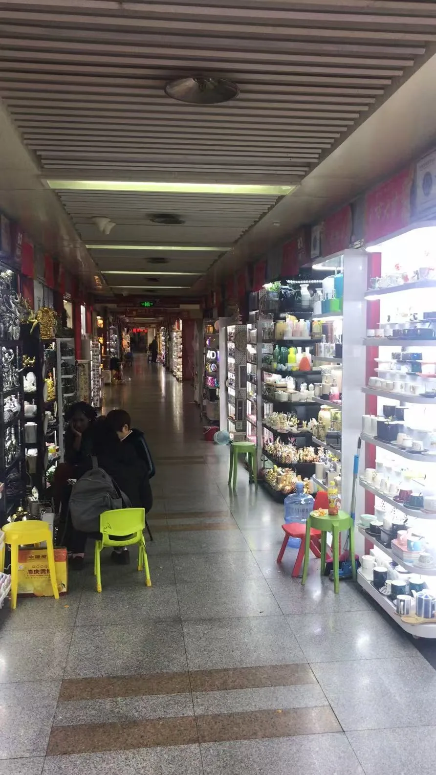 A wholesale market aisle in China lined with supplier booths