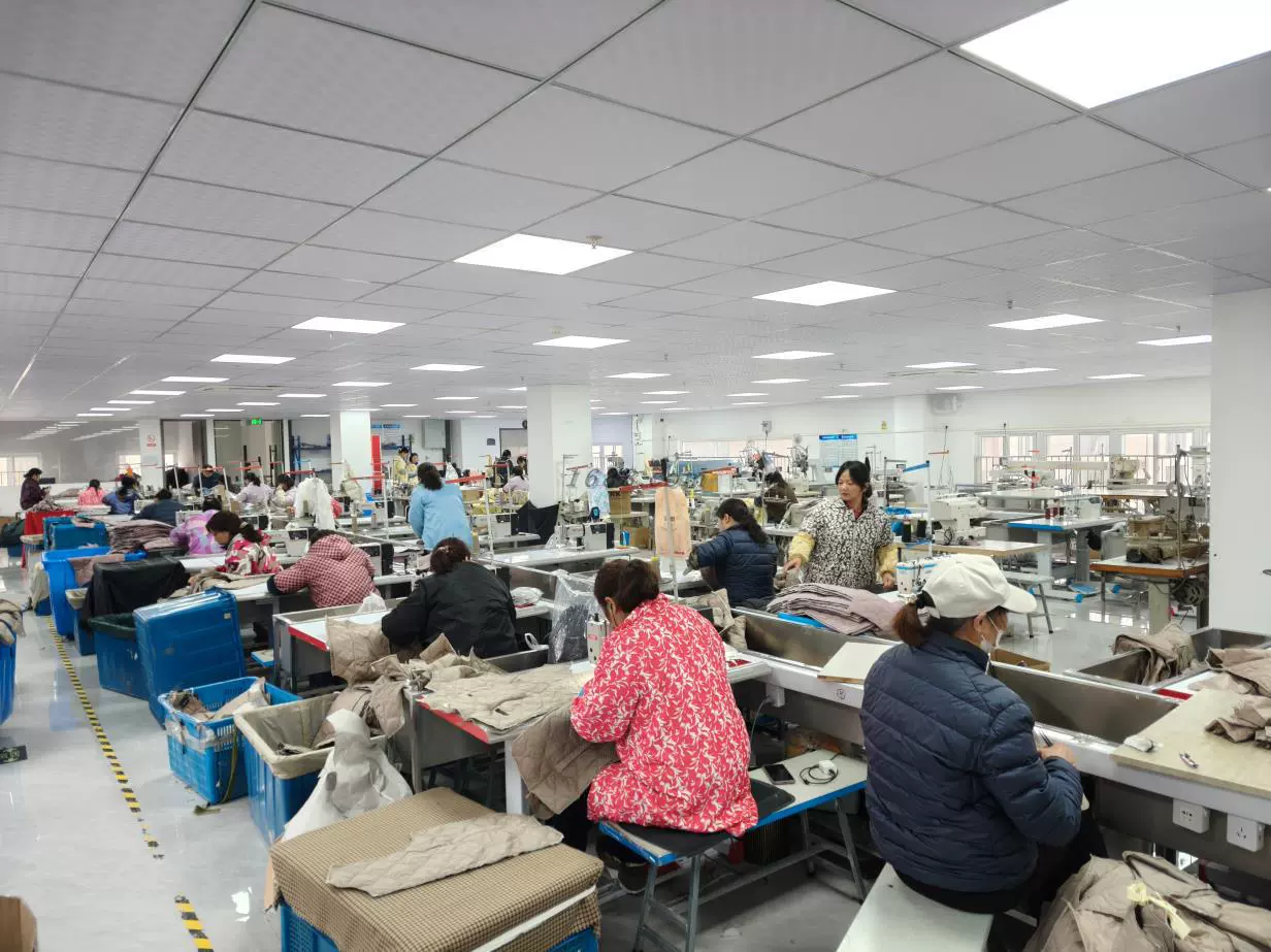 Source clothing from China — real garment factory production floor