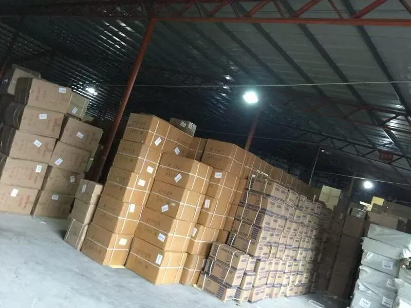 Consolidated export cartons from multiple China suppliers staged together in a warehouse