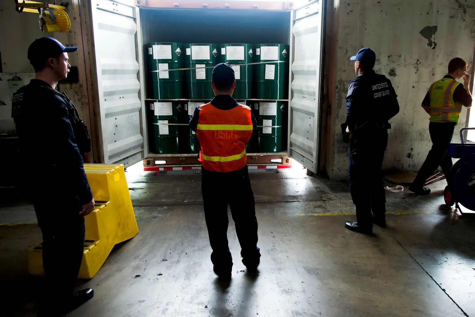 US Coast Guard personnel inspect an imported shipping container at the Port of Long Beach